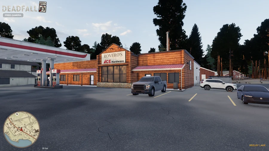 In-engine free-camera view: Rovero’s log-fronted store, Ace Hardware sign and parked vehicles in golden-hour light. Original minimap and location HUD remain visible.